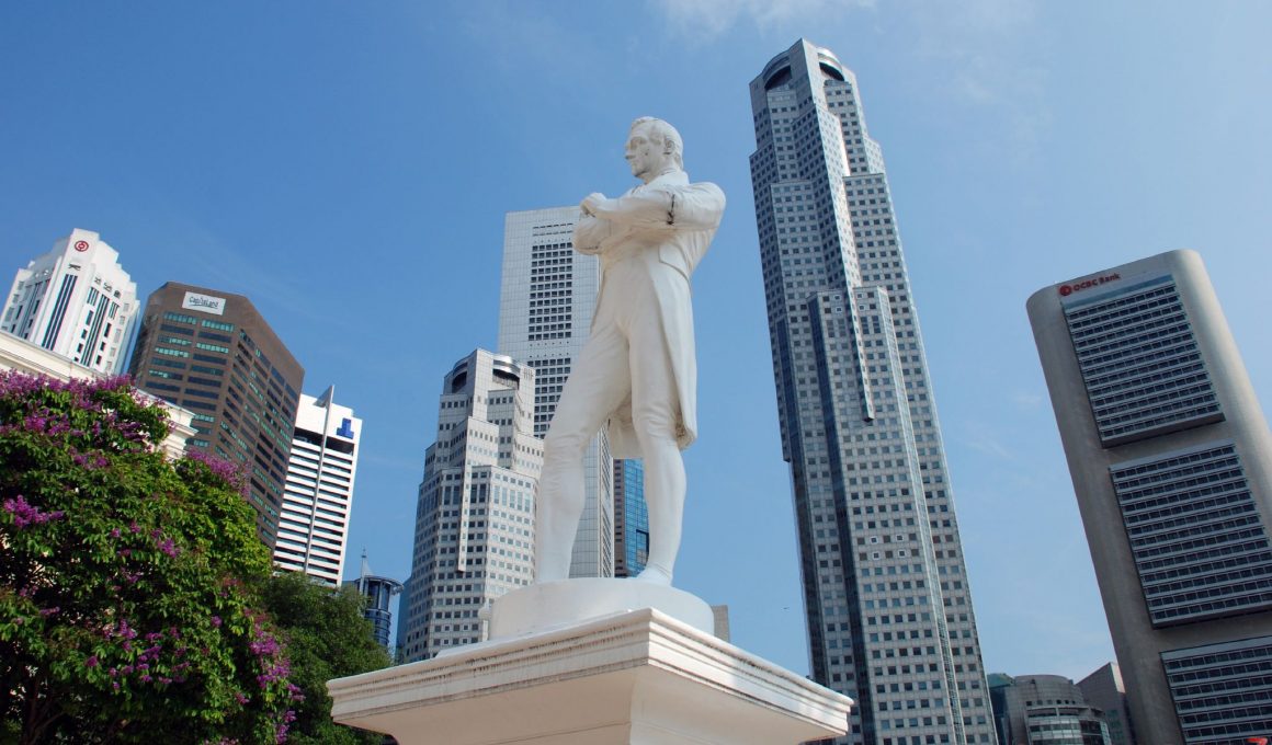 White Statue of Raffles with Singapore city backdrop